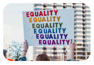 Queer pride costs Person holding up a sign during a queer pride march that reads "Illegal in 70 countries"